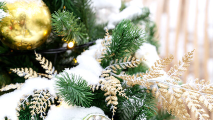 Fototapeta na wymiar Decorated Christmas tree. Close-up of branches and decorative elements. Christmas green background.