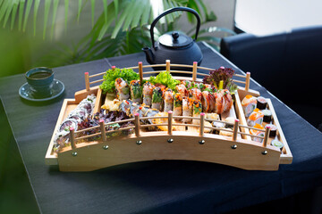Sushi on a wooden bridge to display the dish