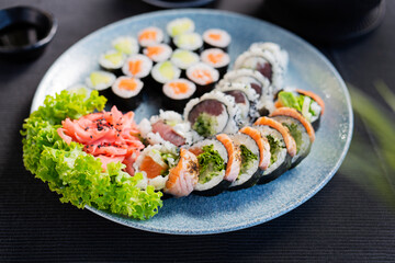 large, colorful set of sushi on the table.