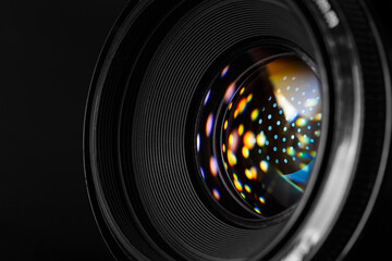 Photo lens with refraction spots close-up.