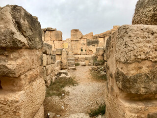 Amman, Jordan, November 2019 - A stone building with a large rock