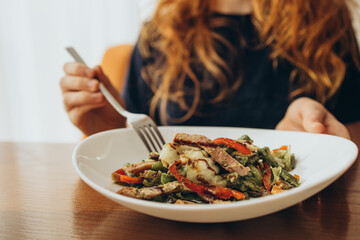 Vegetable salad eaten from a large plate