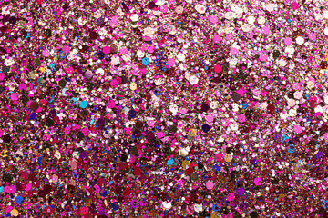 Shiny bright pink glitter as background, top view