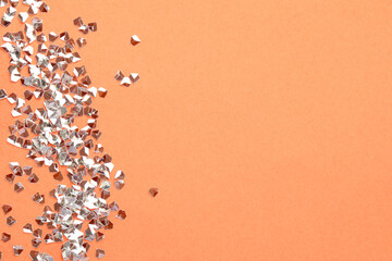 Fototapeta na wymiar Pile of shiny glitter on pale pink background, flat lay. Space for text