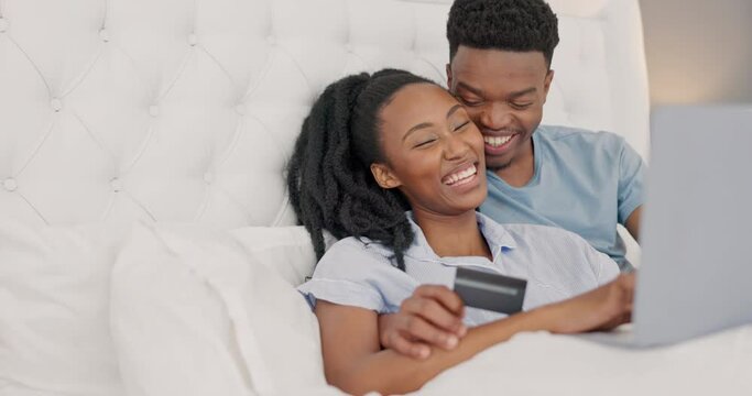Bed, credit card and couple online shopping for ecommerce, website application or finance management at home. Rich, wealth and black people relax in bedroom pc banking, credit score or easy payment