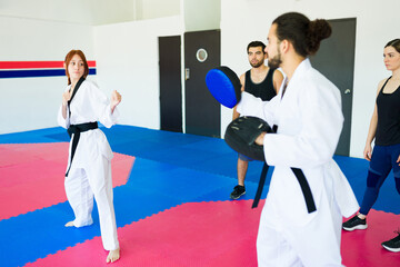 Fototapeta na wymiar Female adult student ready for a karate practice