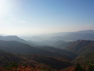 Obraz premium Bukhansan National Park. Mangwolsa Temple. autumn mountains. hiking Korean mountains. mountain landscapes in autumn. trekking. rise to the top of the mountain. fine dust in Korea