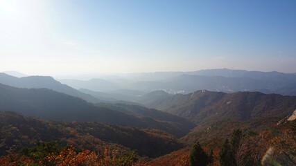Obraz premium Bukhansan National Park. Mangwolsa Temple. autumn mountains. hiking Korean mountains. mountain landscapes in autumn. trekking. rise to the top of the mountain. fine dust in Korea