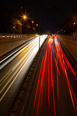 Fototapeta na wymiar Night traffic, car lights at night on a city street