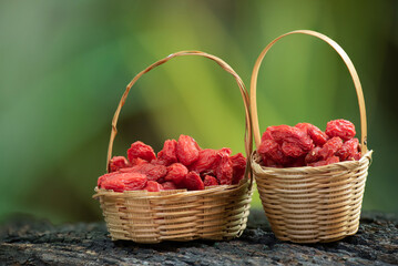 Goji berry or Lycium barbarum fruits on nature background.