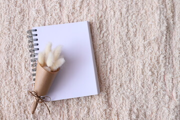 Blank notebook with dried flower