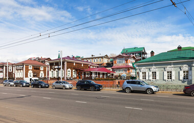 Fototapeta na wymiar View of the historical 130 quarter or Irkutsk Sloboda with old wooden buildings, museums, cafes and shops - a place of recreation and leisure for citizens and tourists