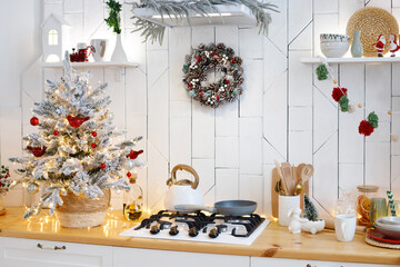 tree in the christmas kitchen at home. scandinavian style kitchen