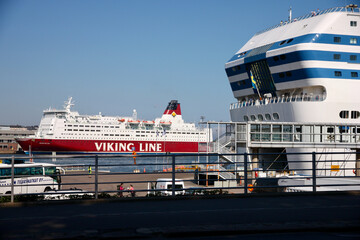 Helsinki, Finland, February 2018 - A truck is parked in front of a large ship in the background