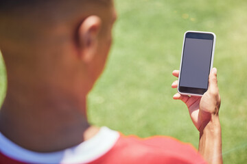 Man, soccer player and phone on field with screen, blank and mockup on the internet. Man, football...