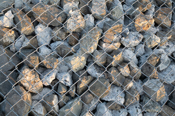 Cobblestones covered with iron net