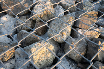 Cobblestones covered with iron net