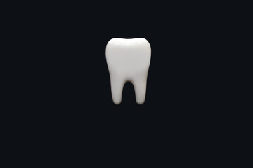 A molar on a black background in the center of the image. Medical concept of dental health and...