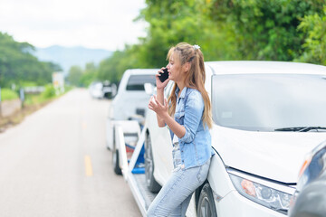 Caucasian Woman Driver Making Phone Call To Insurance Agent After Traffic Accident. Accident. Car...