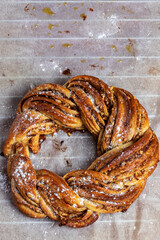 Roscón de reyes Kringle Estonia. Typical Christmas sweet, braided sponge cake with cinnamon, butter, walnuts or almonds and icing sugar.