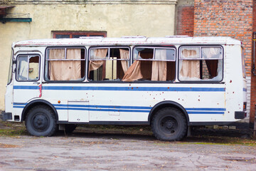 Broken, shelled, broken bus windows during the war