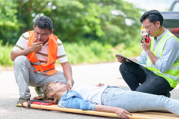 An injured woman in a plastic stretcher after a car accident ,Car accident insurance concept