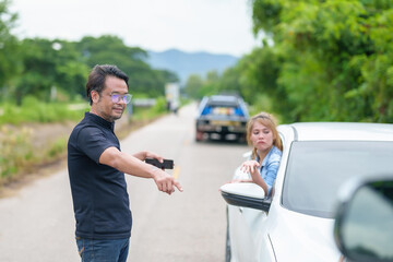 Two drivers having argument over who is guilty in car crash accident. Road safety and insurance concept