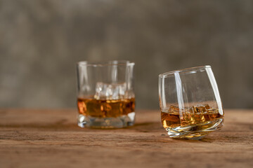 
Close-up of serious businessman holding whiskey glass shows concept of executive privilege. Soft...