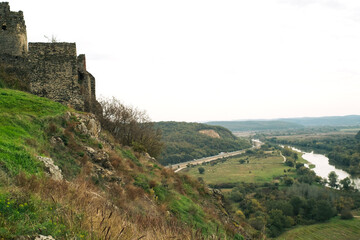Fototapeta na wymiar Ruins of medieval mountain Romanian castle Şoimoş Fortress (Cetatea Soimos Lipova Arad Romania) and valley of river Mures