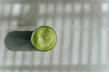 green foam matcha in a glass