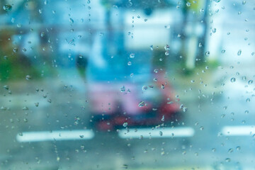 Water droplets on a window glass in a rainy day