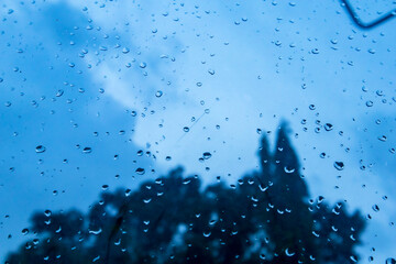 Water droplets on a window glass in a rainy day