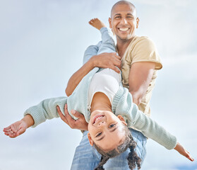 Fototapeta premium Happy, summer with father and girl playing together with love, care and happiness. Upside down child with a happy smile with dad spending quality time outdoor having kid fun in the sun on vacation