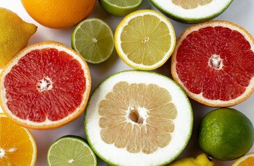 Fototapeta na wymiar sliced citrus fruits on a white background
