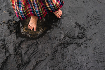 Foot on the black beach