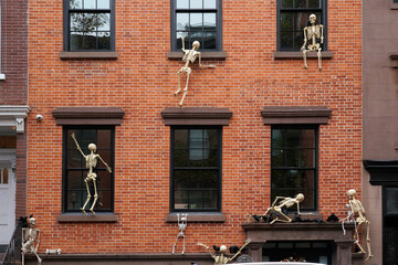   New York, NY- Skeletons invade a Manhattan brownstone for Halloween