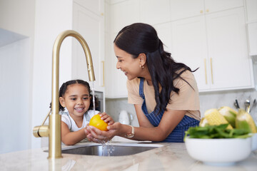 Vegetable, family and washing with a girl and mother cleaning a pepper in the kitchen of the home together for hygiene. Kids, health and cooking with a woman and daughter using a basin to rinse food - obrazy, fototapety, plakaty