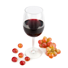 Wine in a wine glass and grapes isolated on white.