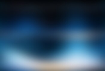 Blur dark blue polished background bottom illuminated. Smooth texture.