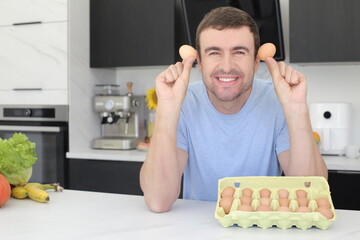 Man using eggs to prepare a meal 