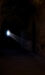 Fototapeta premium light at the end, tunnel of light, tunnel in the night, beam of light, light in the dark, light in the historic site