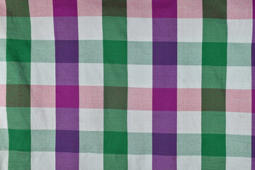 Colorful traditional textiles with a scottish pattern made of cotton material for the background.