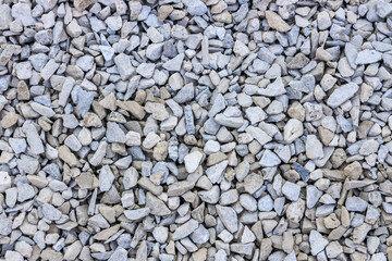 background of stone pebbles pattern, tan, gray and white rocks