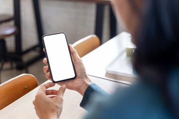 cell phone blank white screen mockup.hand holding texting using mobile on desk at office.background empty space for advertise.work people contact marketing business,technology