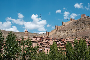 Fototapeta na wymiar Panoramic view of the town of Albarracin in Teruel (Spain), with the town in the foreground and the medieval walls on top of the hill.
