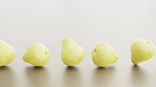 Ripe pear fruits on a light background.