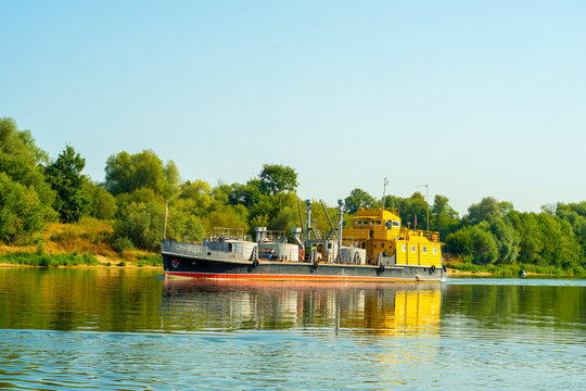 RU, Puschino 25.08.2022: A small river ship Titmouse floats on the river.
