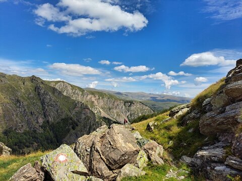 Beautiful shot of the rocky green mountains under a bright sky in Korab, North Macedonia