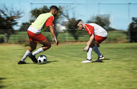 Soccer, friends and training and workout with men playing on a sports field, competitive training for sports goal. Ball, team and energy with exercise, fitness and practice outdoor football on grass