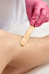 Fototapeta na wymiar Laser depilation or photoepilator process on a woman leg.